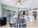 Relaxing dining area with sliding glass doors leading to an outdoor patio and views of the backyard at 566 Corrientes Cir, Punta Gorda, FL 33983