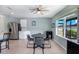 Cozy dining area with a modern table set and views of the backyard and stainless steel appliances at 566 Corrientes Cir, Punta Gorda, FL 33983