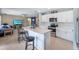 Open concept kitchen with a breakfast bar that flows into the living area, ideal for entertaining at 566 Corrientes Cir, Punta Gorda, FL 33983