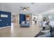 Open-concept living room with tile floors and a view of the kitchen at 566 Corrientes Cir, Punta Gorda, FL 33983