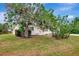 Charming home with a lush front yard and mature landscaping at 610 Cumberland Rd, Venice, FL 34293