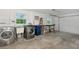 This is a spacious garage with washer, dryer, utility sink, work bench, and ample room for storage at 610 Cumberland Rd, Venice, FL 34293