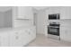 Contemporary kitchen with stainless steel appliances, sleek countertops, and modern finishes at 610 Cumberland Rd, Venice, FL 34293