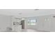 Bright kitchen features stainless steel appliances, white cabinetry, and ample natural light at 610 Cumberland Rd, Venice, FL 34293
