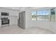 Modern kitchen featuring stainless steel appliances, white cabinetry, and new flooring at 610 Cumberland Rd, Venice, FL 34293