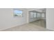 Bright room with modern flooring and large window looking out to the neighborhood at 610 Cumberland Rd, Venice, FL 34293
