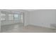 Bright room featuring sleek flooring and sliding door access to a separate room at 610 Cumberland Rd, Venice, FL 34293