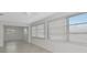 A bright sun room includes tile floors, lots of natural light, and exterior views at 610 Cumberland Rd, Venice, FL 34293