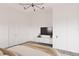 Comfortable bedroom with simple furniture, large television, and neutral colors at 6137 Grove Blvd, Punta Gorda, FL 33982