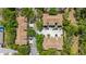 Aerial view of attached villas, mature landscaping, and ample parking at 6320 Rosefinch Ct # 101, Lakewood Ranch, FL 34202