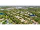 Aerial view of a residential area, trees, ponds, and neighborhood at 6320 Rosefinch Ct # 101, Lakewood Ranch, FL 34202