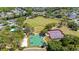 Aerial view of community park featuring a baseball field, basketball court, and tennis court at 6320 Rosefinch Ct # 101, Lakewood Ranch, FL 34202