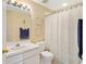 Bright bathroom featuring a shower-tub combo, fresh paint, and updated vanity at 6320 Rosefinch Ct # 101, Lakewood Ranch, FL 34202