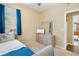 Bedroom featuring a daybed, neutral walls, and a small view of the attached bathroom at 6320 Rosefinch Ct # 101, Lakewood Ranch, FL 34202