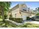Well-maintained condo featuring attached garages, neat landscaping, and a bright exterior at 6320 Rosefinch Ct # 101, Lakewood Ranch, FL 34202