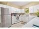 Bright kitchen with clean white cabinetry and stainless-steel appliances at 6320 Rosefinch Ct # 101, Lakewood Ranch, FL 34202