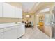 Bright kitchen with an open layout featuring a cozy dining area and tile floors at 6320 Rosefinch Ct # 101, Lakewood Ranch, FL 34202