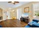 Bright living room with hardwood floors, backyard views, and stylish furnishings at 6320 Rosefinch Ct # 101, Lakewood Ranch, FL 34202