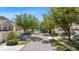 Picturesque street view featuring mature trees lining a quiet neighborhood with well-maintained homes at 6320 Rosefinch Ct # 101, Lakewood Ranch, FL 34202