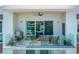 Relaxing balcony with glass railings, seating area and great views at 635 S Orange Ave # 404, Sarasota, FL 34236