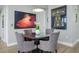 Elegant dining room features a glass-topped table with seating for four, and art accents at 635 S Orange Ave # 404, Sarasota, FL 34236