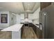 Modern kitchen featuring stainless steel appliances, a chef's range, and an island with bar seating at 635 S Orange Ave # 404, Sarasota, FL 34236