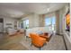 Bright living area features modern decor, with access to bedroom and balcony at 635 S Orange Ave # 404, Sarasota, FL 34236