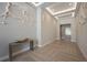 Elegant lobby featuring a unique tree sculpture, custom lighting, and modern seating at 635 S Orange Ave # 404, Sarasota, FL 34236