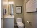 Stylish powder room with modern vanity, framed art, and sleek fixtures at 635 S Orange Ave # 404, Sarasota, FL 34236