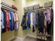 Organized walk-in closet with clothing racks, shelving, and storage baskets for optimal organization at 635 S Orange Ave # 404, Sarasota, FL 34236