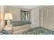 Bright bedroom with balcony access features closet space and neutral carpeting at 6450 Wild Oak Bay Blvd # 240, Bradenton, FL 34210