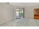 Bright bedroom with balcony access features a closet and neutral carpeting at 6450 Wild Oak Bay Blvd # 240, Bradenton, FL 34210