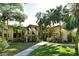 Beautiful exterior view of condos with mature landscaping and inviting walkway at 6450 Wild Oak Bay Blvd # 240, Bradenton, FL 34210