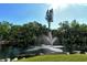 Beautiful view of the water fountain, lush tropical landscaping and the pond at 6450 Wild Oak Bay Blvd # 240, Bradenton, FL 34210