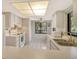 Bright kitchen with white appliances, white tile floor, and breakfast nook at 6450 Wild Oak Bay Blvd # 240, Bradenton, FL 34210