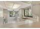 Bright kitchen features white cabinets, a modern sink, and a large window overlooking a green view at 6450 Wild Oak Bay Blvd # 240, Bradenton, FL 34210