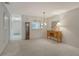 Open living room features neutral walls, a dining area, and a view into the entry hallway at 6450 Wild Oak Bay Blvd # 240, Bradenton, FL 34210