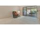 Cozy living room with a recliner, side table and a sliding glass door that leads to the outside patio at 6450 Wild Oak Bay Blvd # 240, Bradenton, FL 34210
