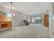 Bright living room with neutral carpet, slider to porch and a comfortable recliner chair at 6450 Wild Oak Bay Blvd # 240, Bradenton, FL 34210
