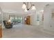 Bright living room with slider to covered porch and view of the bedroom hallway at 6450 Wild Oak Bay Blvd # 240, Bradenton, FL 34210