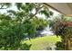 Scenic view of a community pond with fountain and lush landscaping at 6450 Wild Oak Bay Blvd # 240, Bradenton, FL 34210