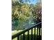Picturesque pond with fountain surrounded by lush greenery, creating a peaceful view at 6450 Wild Oak Bay Blvd # 240, Bradenton, FL 34210