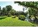 Scenic view of a community pond with fountain and lush landscaping at 6450 Wild Oak Bay Blvd # 240, Bradenton, FL 34210
