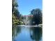 Scenic pond view with a central fountain and lush landscaping creates a serene community setting at 6450 Wild Oak Bay Blvd # 240, Bradenton, FL 34210