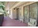 Private covered porch with seating, sliding doors and beautiful views at 6450 Wild Oak Bay Blvd # 240, Bradenton, FL 34210