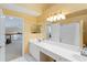 Bathroom with double sinks, lots of vanity space, and shower in tub at 6905 Arbor Oaks Ct, Bradenton, FL 34209