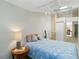 Comfortable bedroom featuring a ceiling fan and sand-themed decorations at 6905 Arbor Oaks Ct, Bradenton, FL 34209