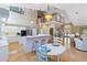 Bright open floor plan featuring a dining area with views of the kitchen and front entrance at 6905 Arbor Oaks Ct, Bradenton, FL 34209