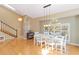 Bright dining area with vaulted ceilings, modern pendant lighting, and hardwood floors at 6905 Arbor Oaks Ct, Bradenton, FL 34209