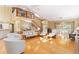 Open-concept living room featuring hardwood floors, a second-story loft, and a modern staircase at 6905 Arbor Oaks Ct, Bradenton, FL 34209